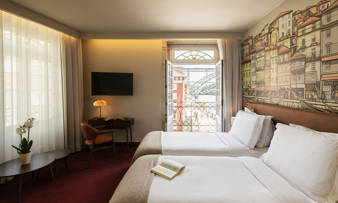 Vintage Bridge View at Pestana Vintage Porto featuring twin beds, mural wall and balcony overlooking the bridge
